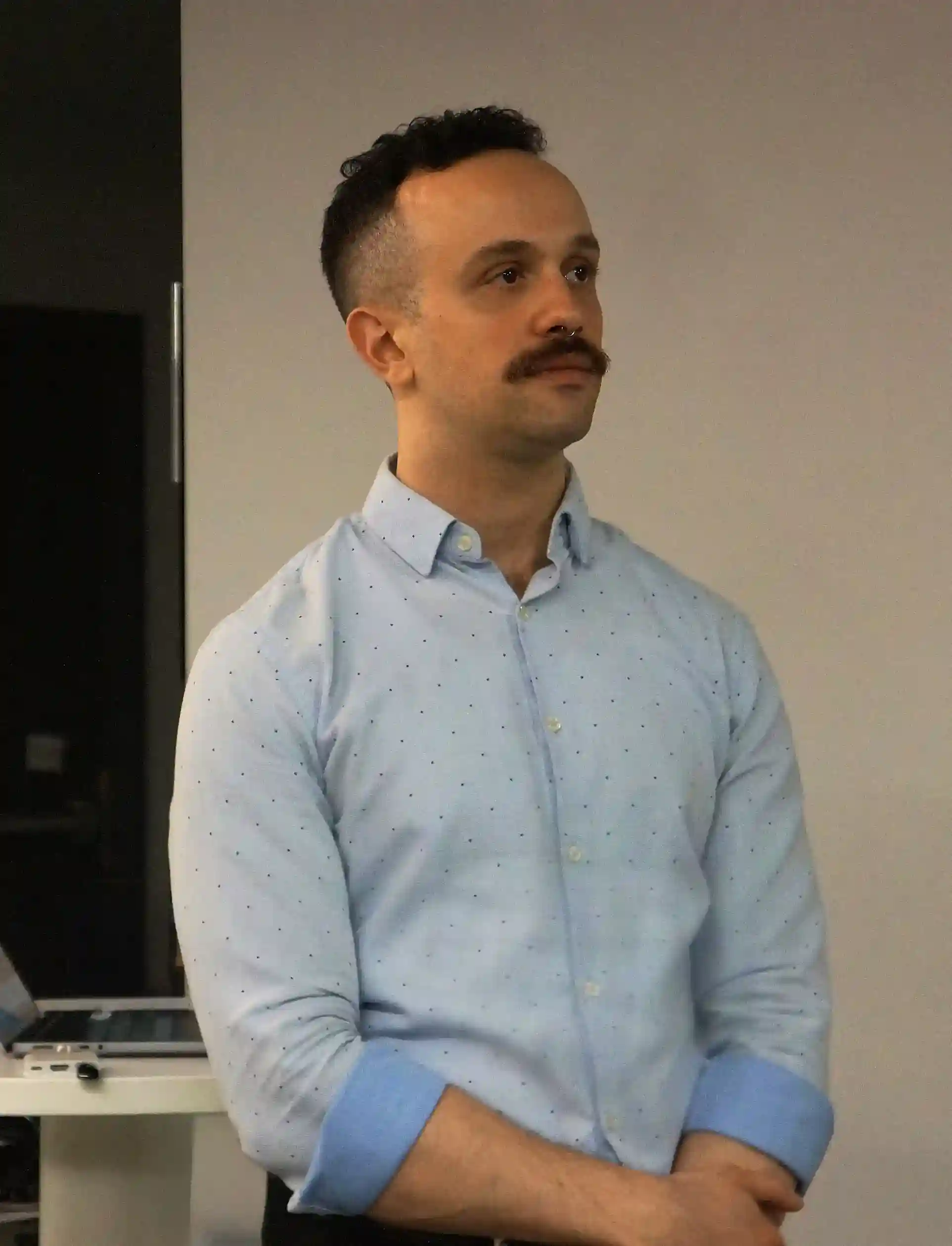 Jamil Standing looking to the right